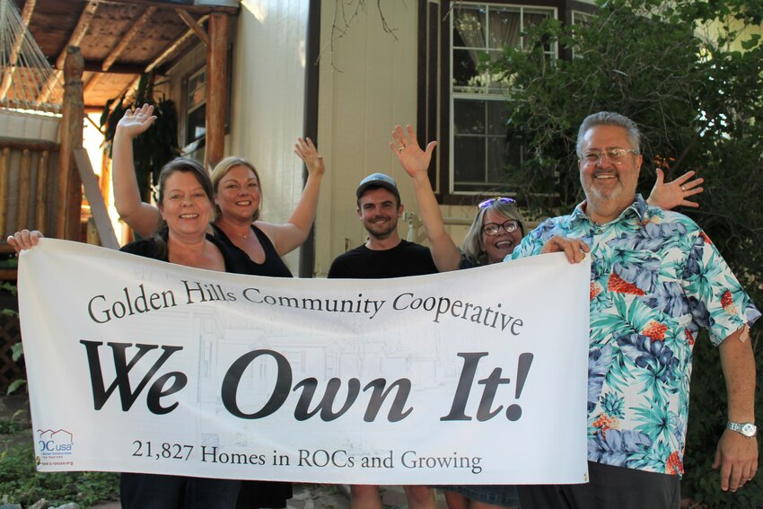 The Golden Hills Mobile Home Park co-op board members celebrate their new status as a resident-owned community. From left, the board members are: Joyce Tanner, Valerie Dillon, Will Gregg, Sally Burton and Art Erwin.